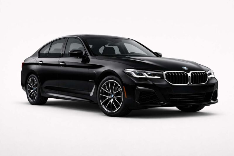 Black BMW 5 Series executive sedan, front three-quarter view